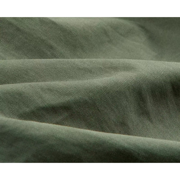 IDLT cargo pants, green fabric folds.