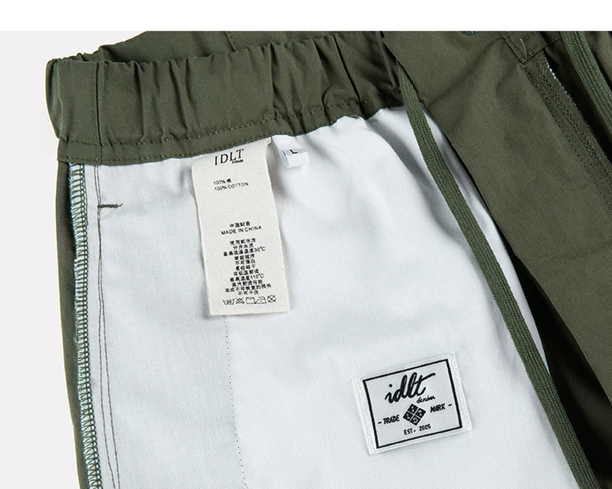 IDLT cargo pants, green inner care label.