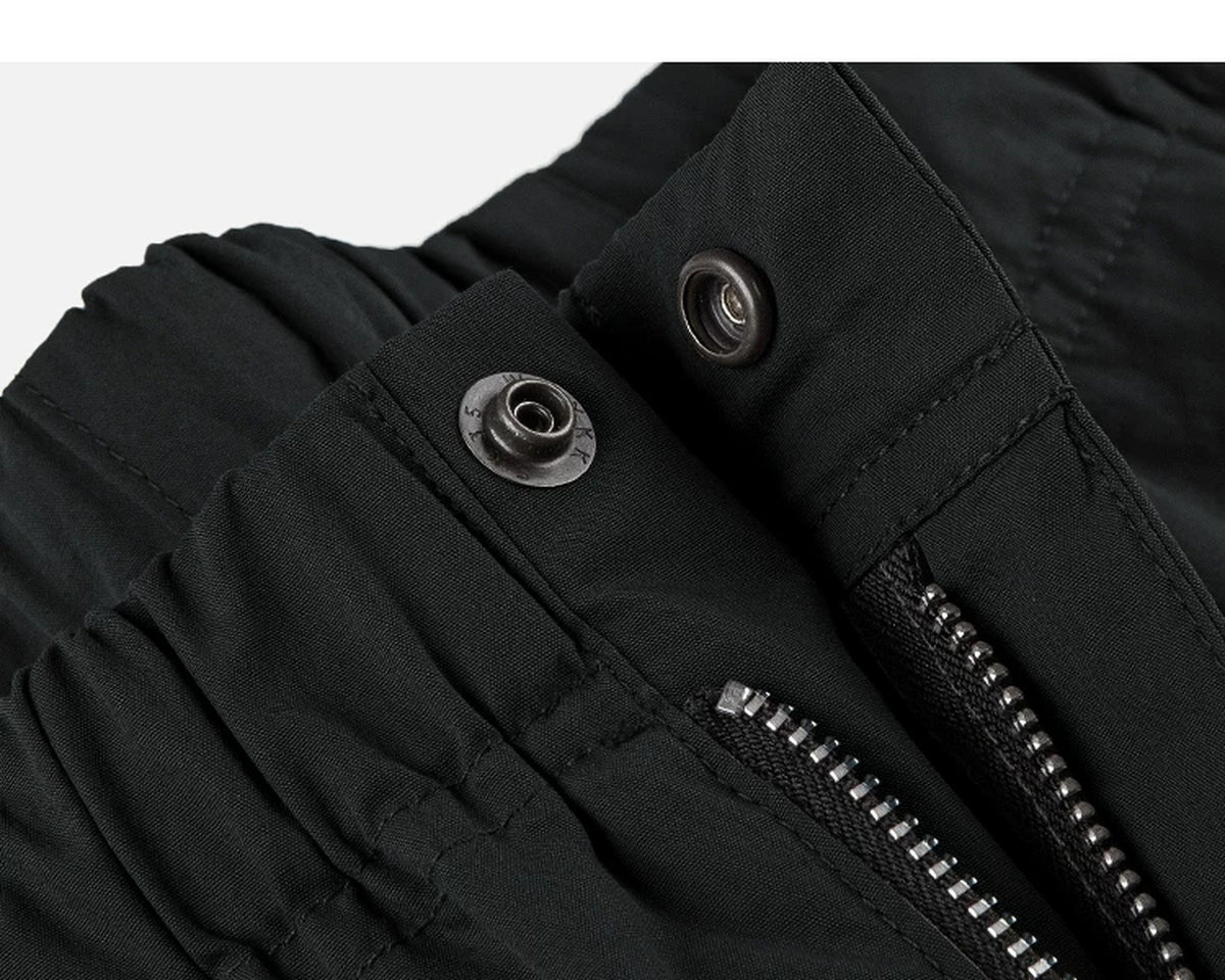 IDLT cargo pants, black waist snap fastener.