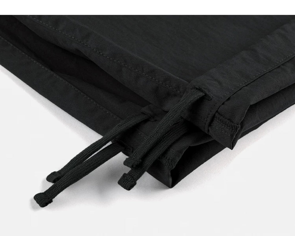 IDLT cargo pants, black ankle drawstrings.