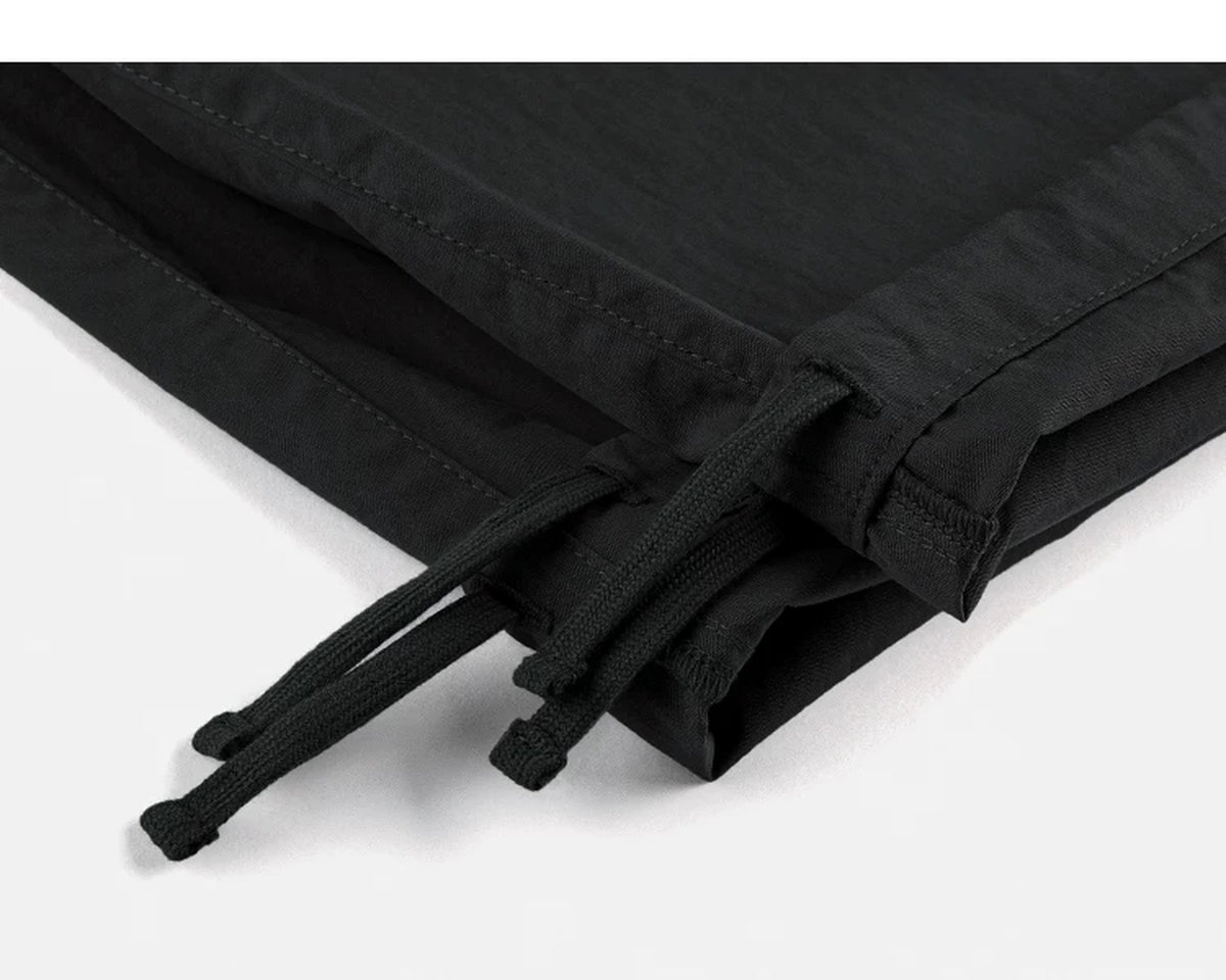 IDLT cargo pants, black ankle drawstrings.