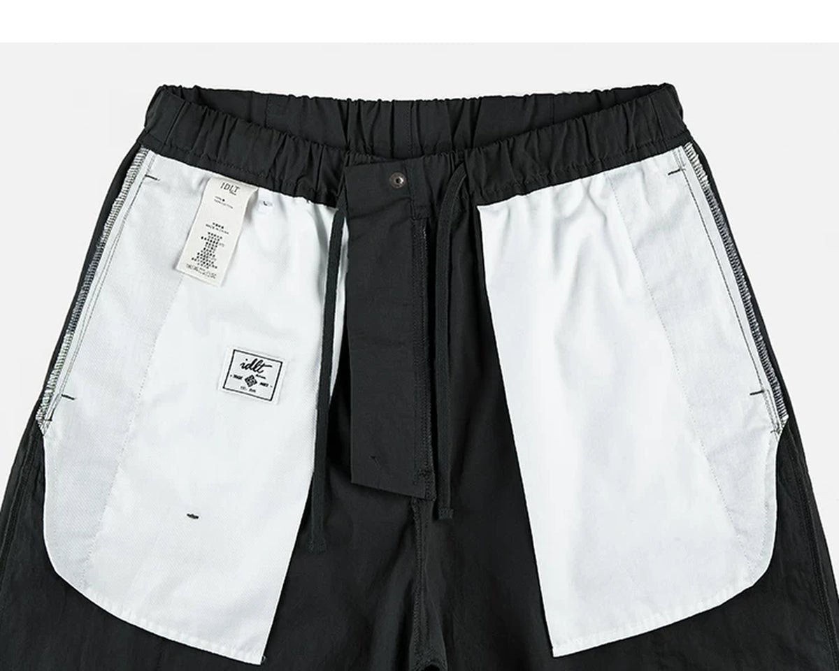IDLT cargo pants, black inner pockets.