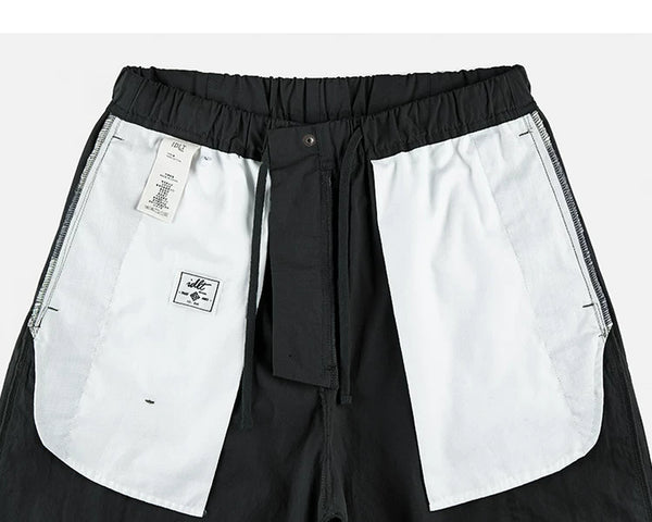 IDLT cargo pants, black inner pockets.