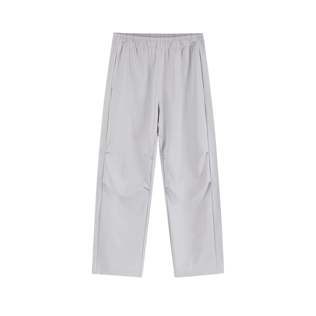 IDLT drawstring trousers, light gray front.