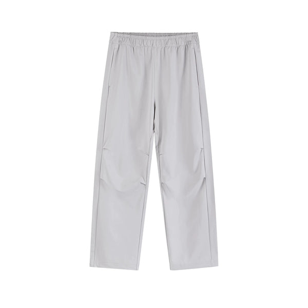 IDLT drawstring trousers, light gray front.