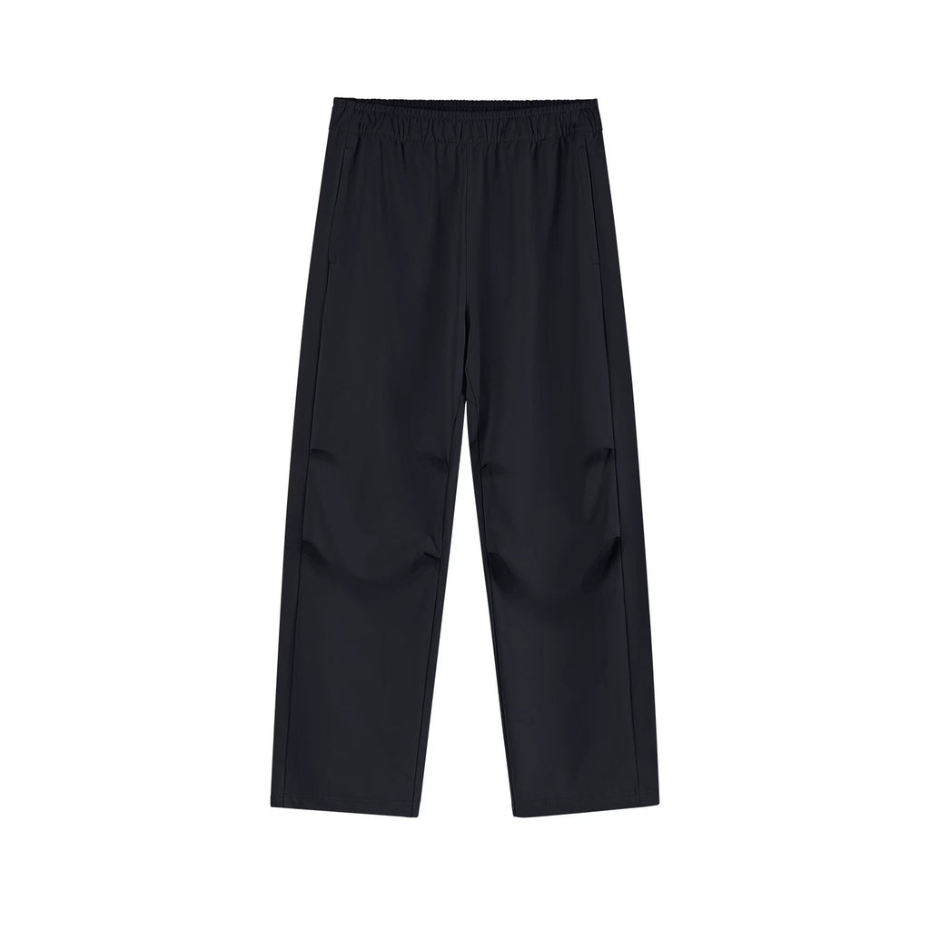 IDLT drawstring trousers, black front.