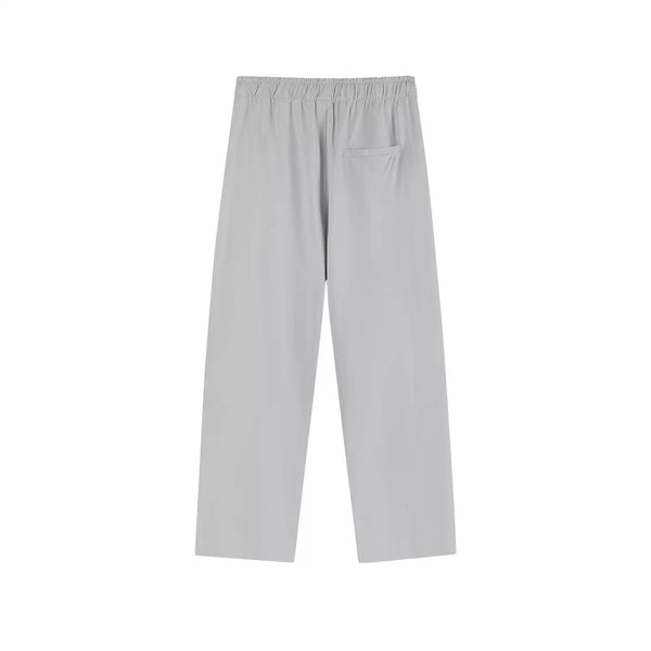 IDLT drawstring trousers, light gray back.