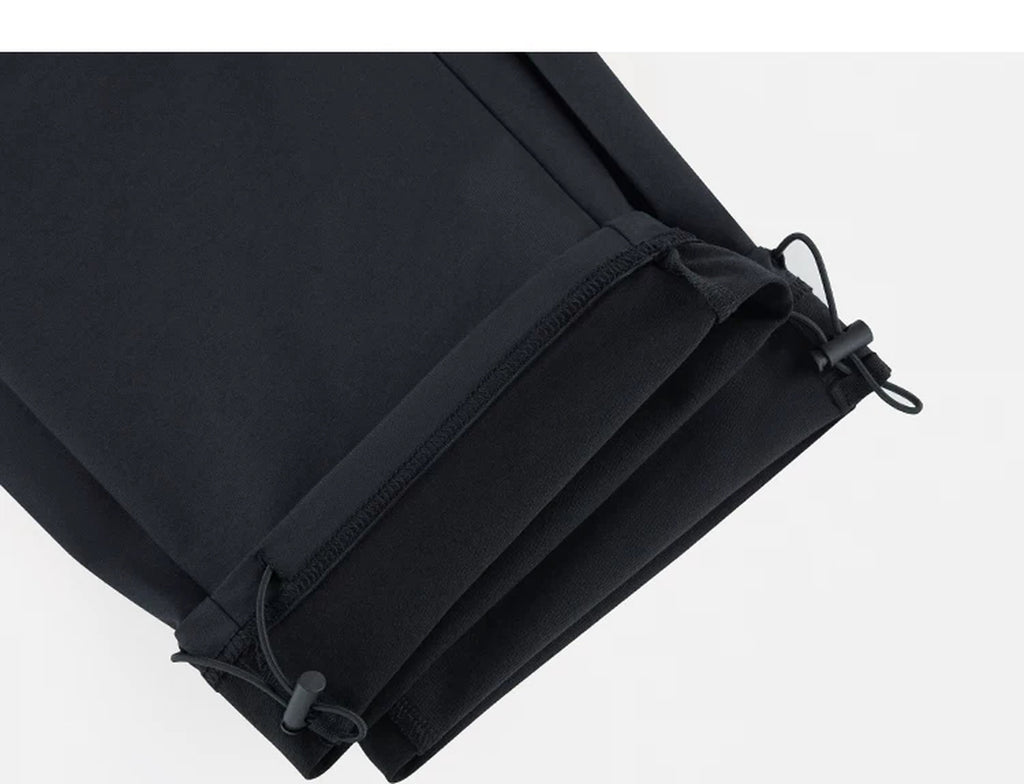 IDLT drawstring trousers, black ankle drawcords.