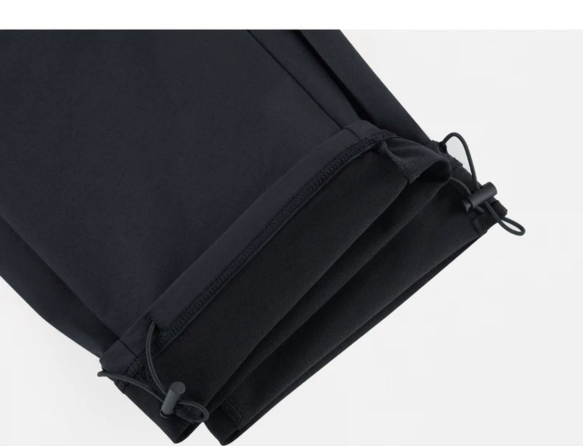 IDLT drawstring trousers, black ankle drawcords.