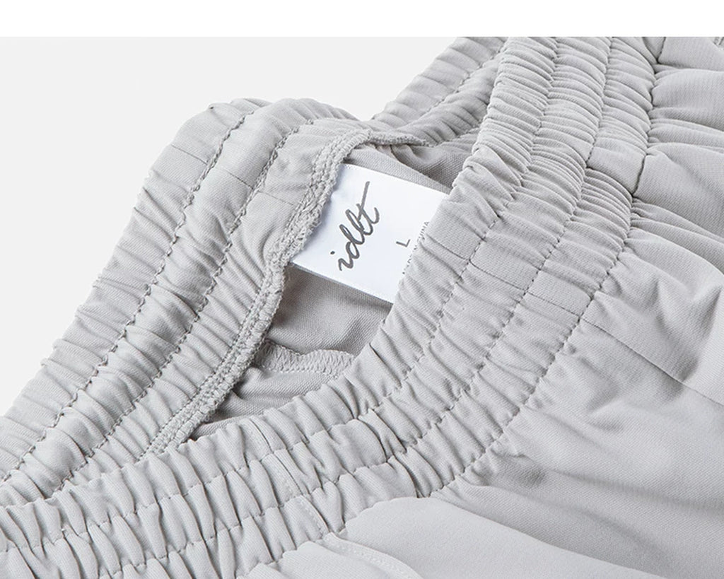IDLT wide leg trousers, light gray waistband label.