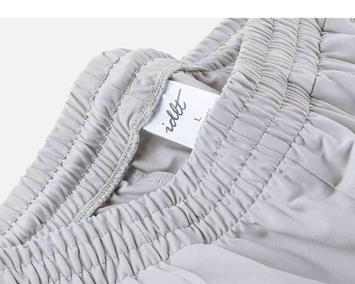 IDLT wide leg trousers, light gray waistband label.