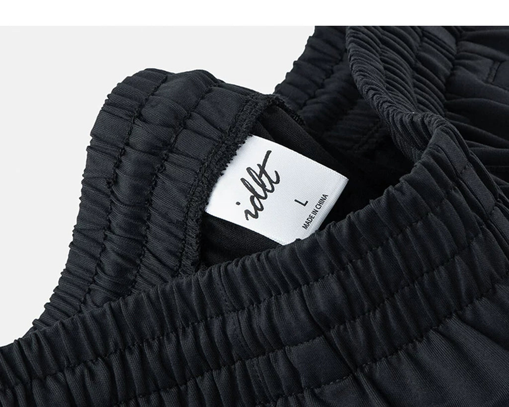 IDLT wide leg trousers, black waistband label.