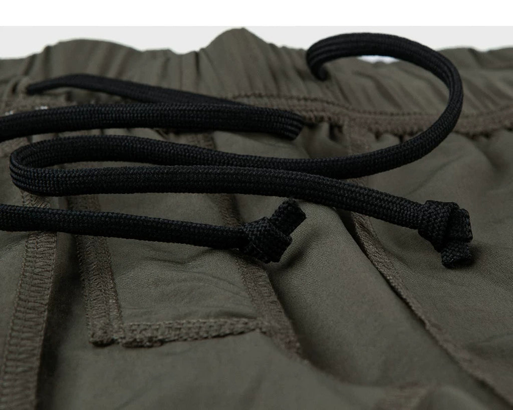 IDLT shorts, olive inner drawstring.
