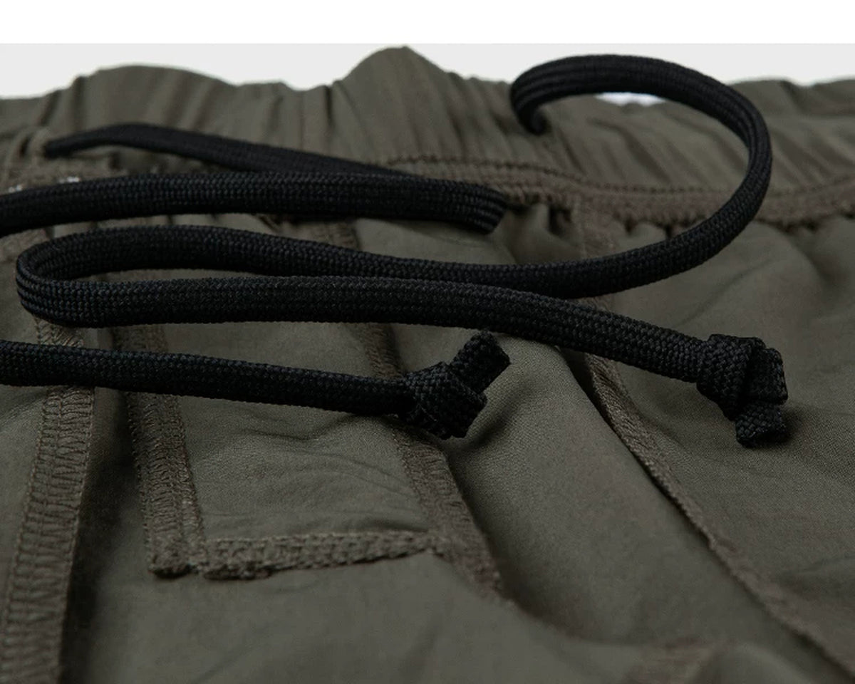 IDLT shorts, olive inner drawstring.