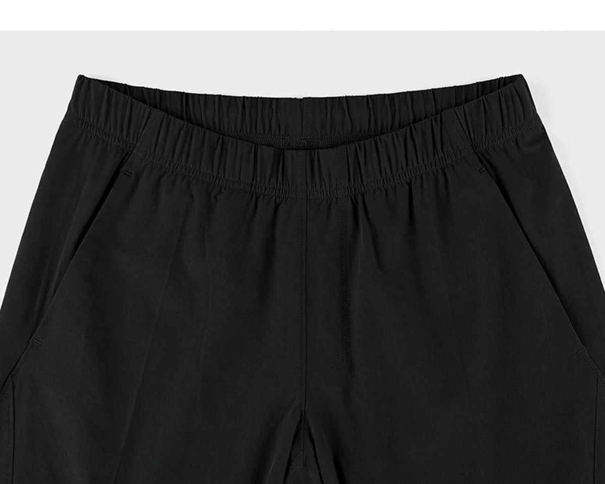 IDLT shorts, black waistband.