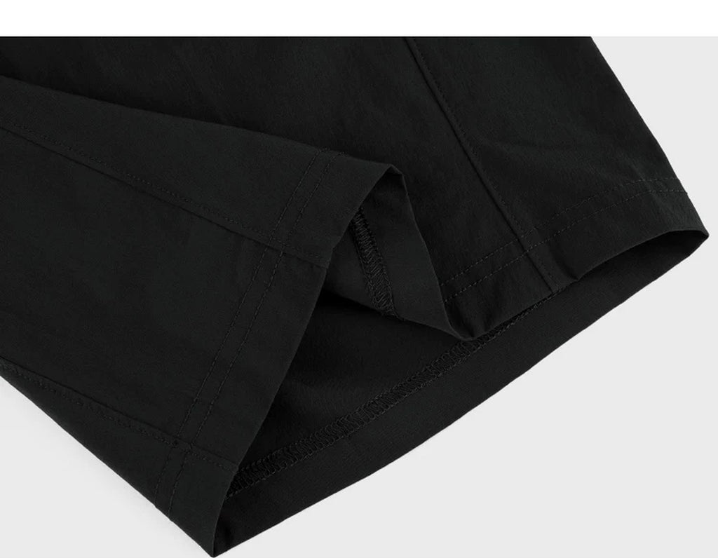 IDLT shorts, black folded hem.