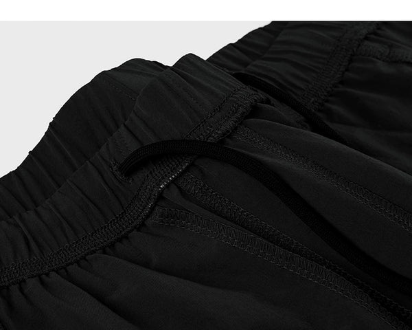 IDLT shorts, black inner drawstring.
