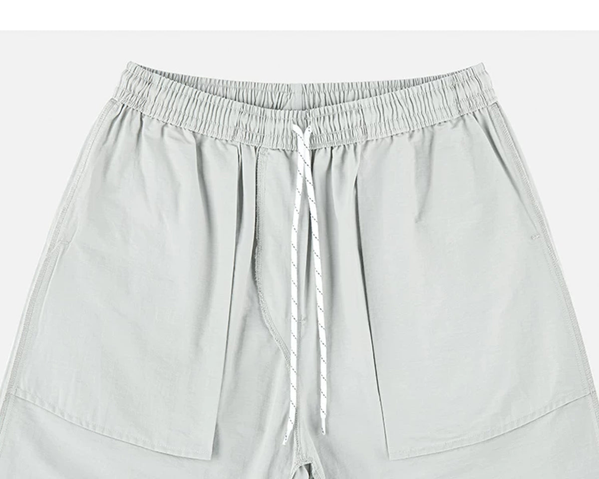 IDLT shorts, light gray inner pockets and drawstring.