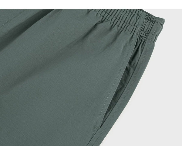 IDLT shorts, green side pocket.