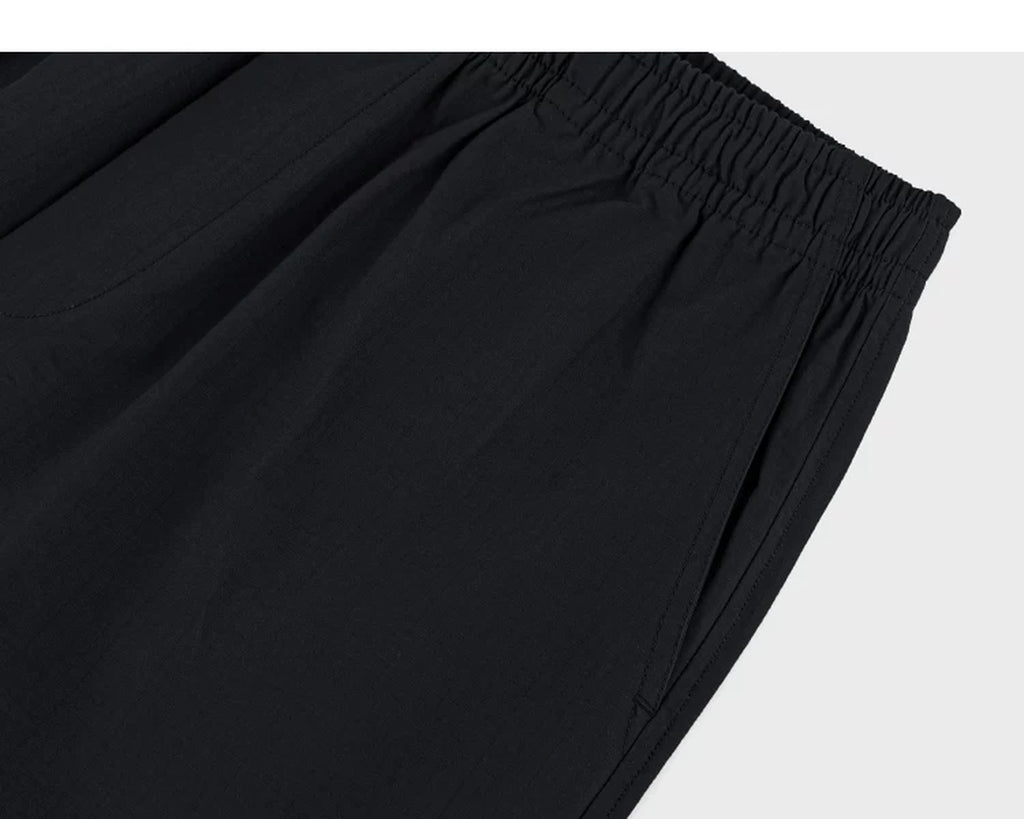 IDLT shorts, black side pocket.