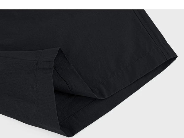 IDLT shorts, black folded hem.