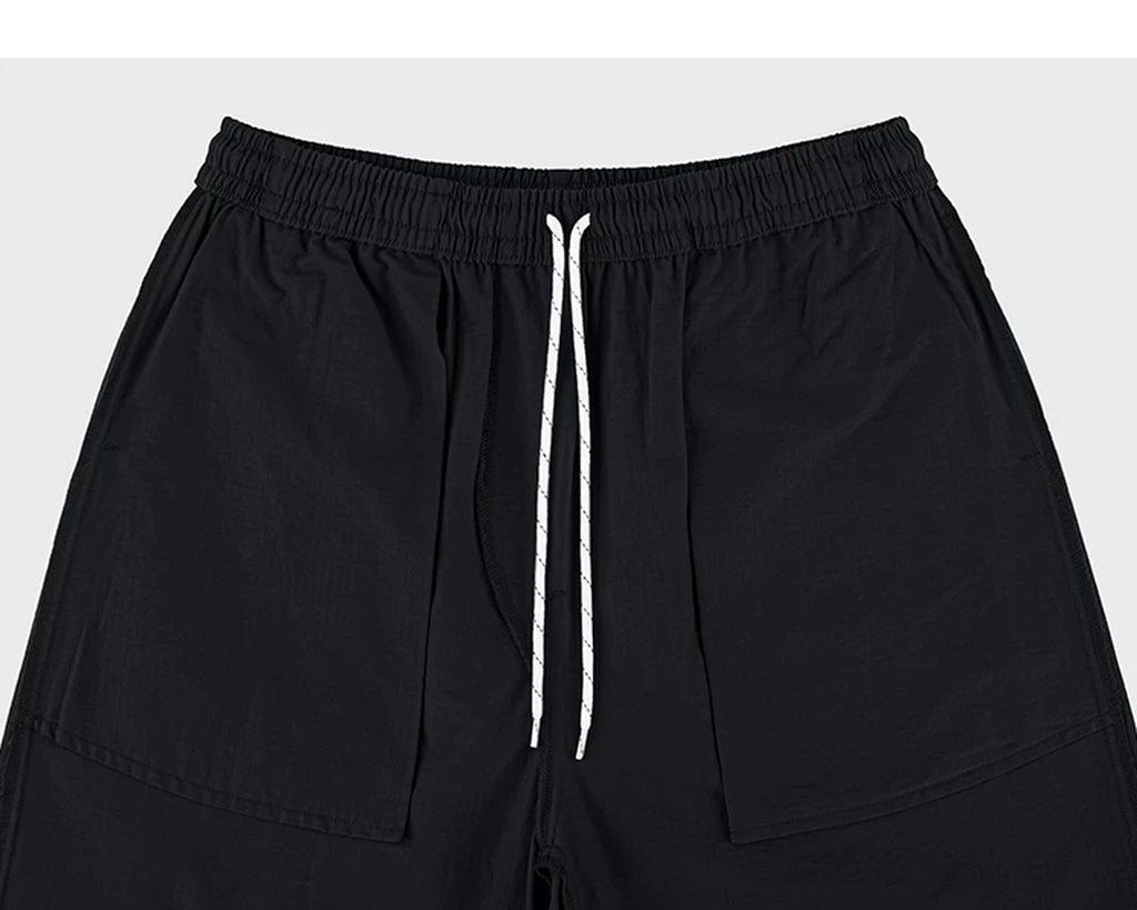 IDLT shorts, black inner pockets and drawstring.
