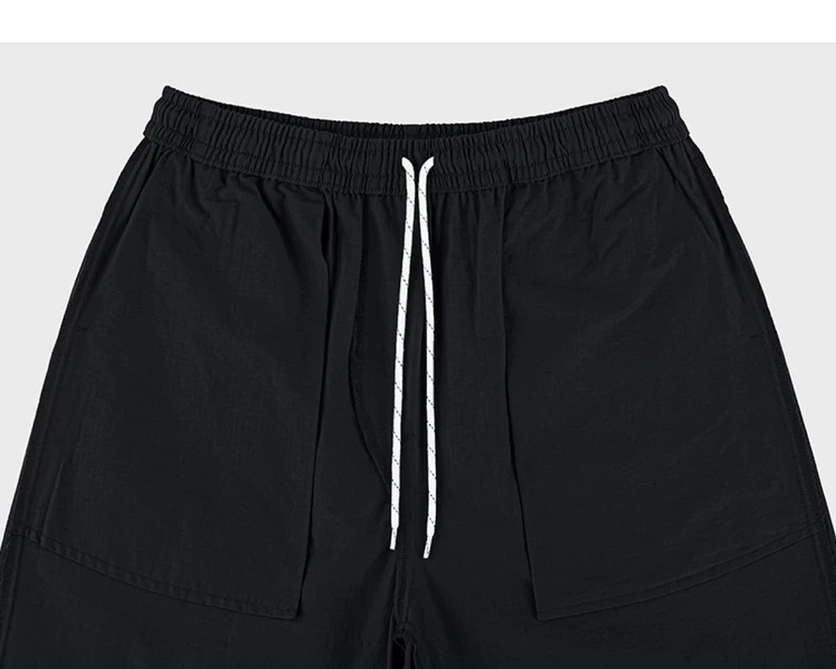 IDLT shorts, black inner pockets and drawstring.