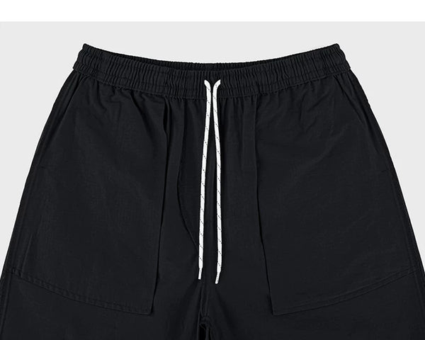 IDLT shorts, black inner pockets and drawstring.