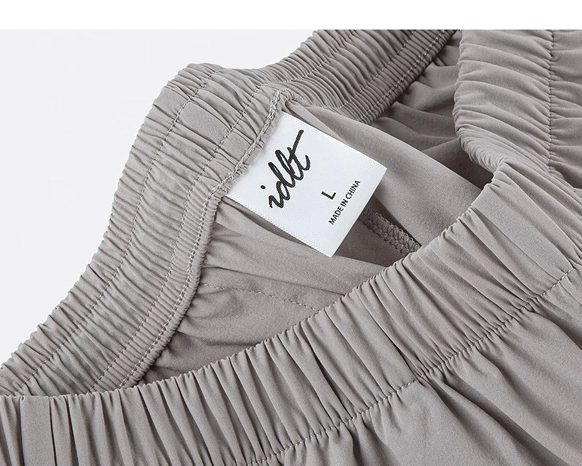 IDLT shorts, beige waistband label.