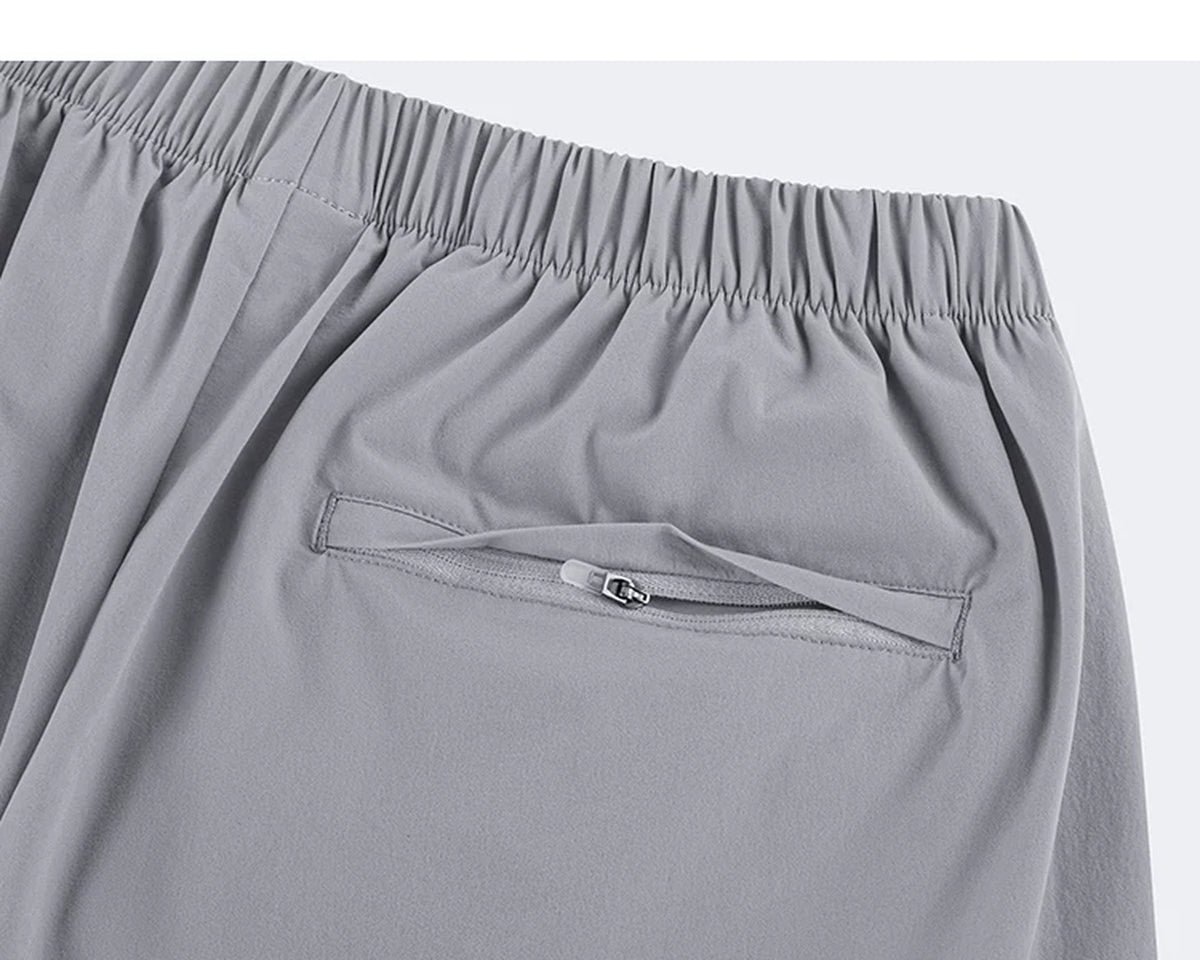 IDLT shorts, light gray zipped back pocket.