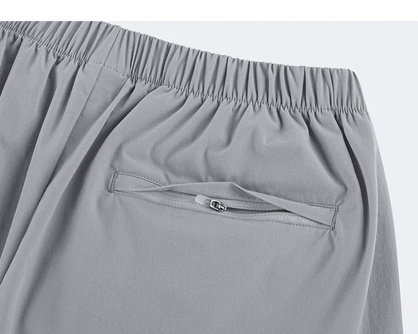 IDLT shorts, light gray zipped back pocket.