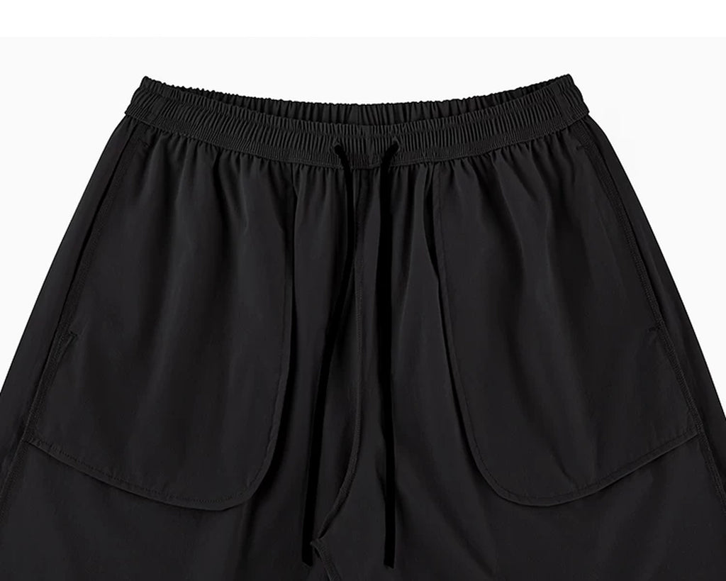 IDLT shorts, black inner pockets.