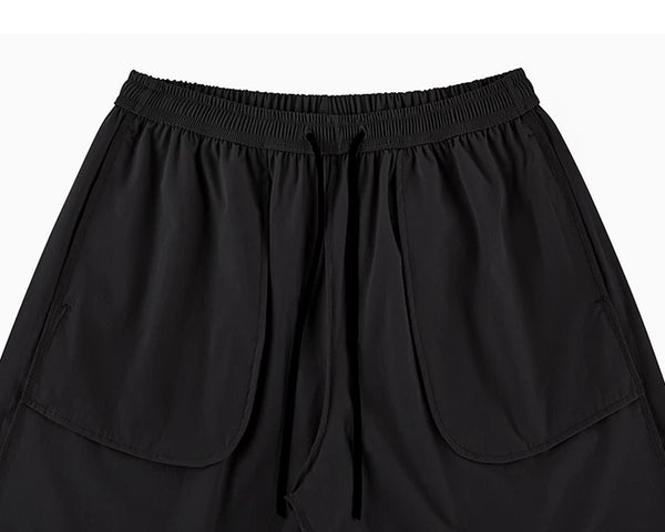 IDLT shorts, black inner pockets.