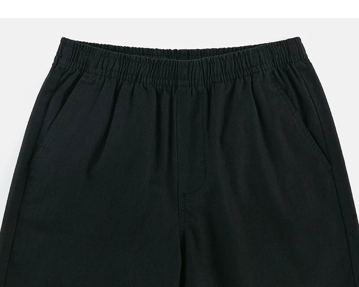 IDLT shorts, black waistband.