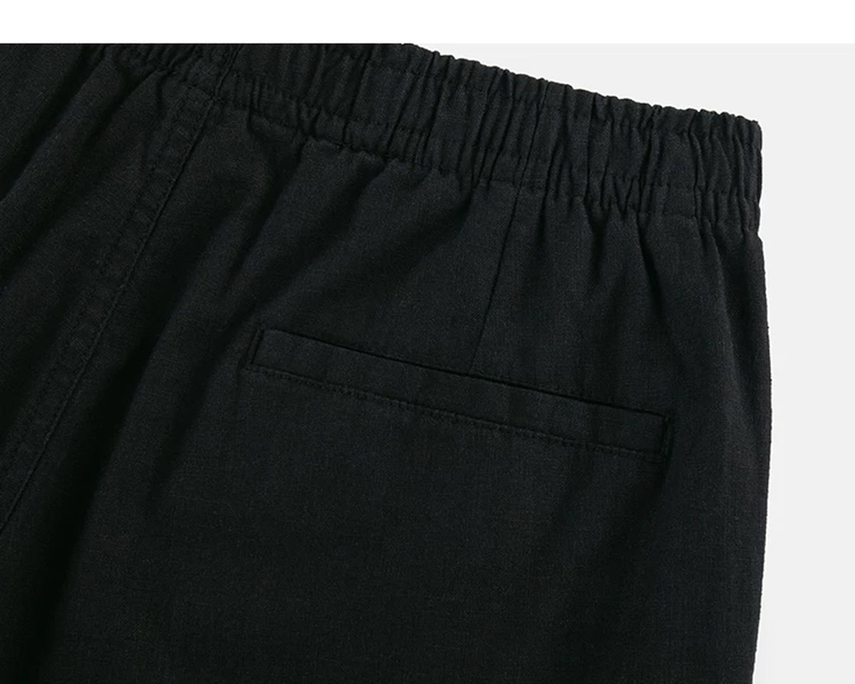 IDLT shorts, black back pocket.