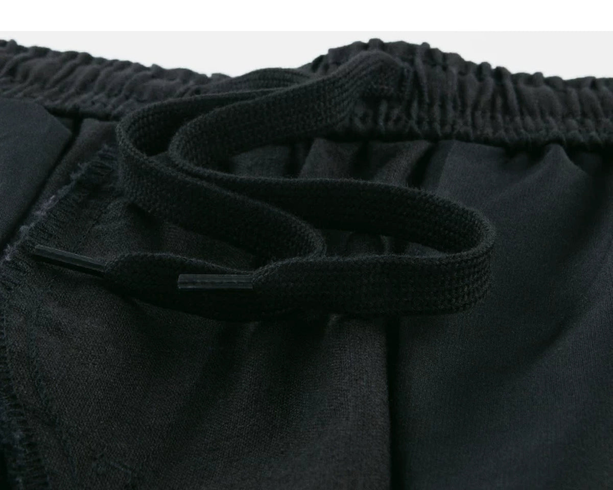 IDLT shorts, black inner drawstring.