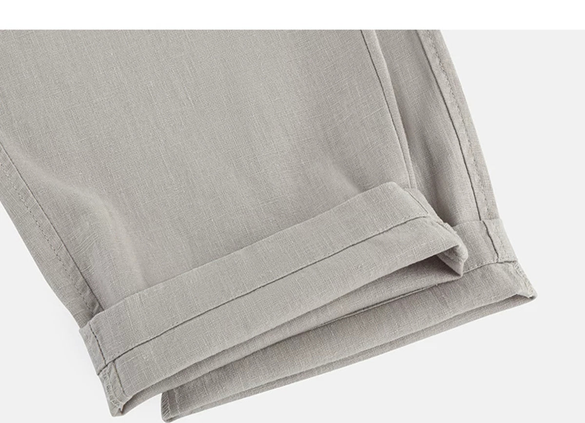 IDLT trousers, beige rolled hems.