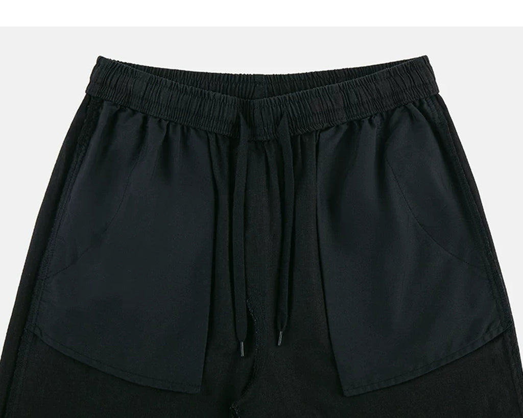 IDLT trousers, black inner pockets.