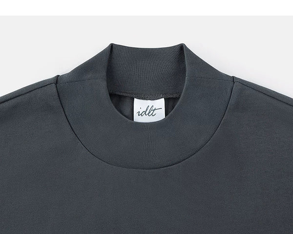 IDLT mock neck T-shirt, dark gray collar.