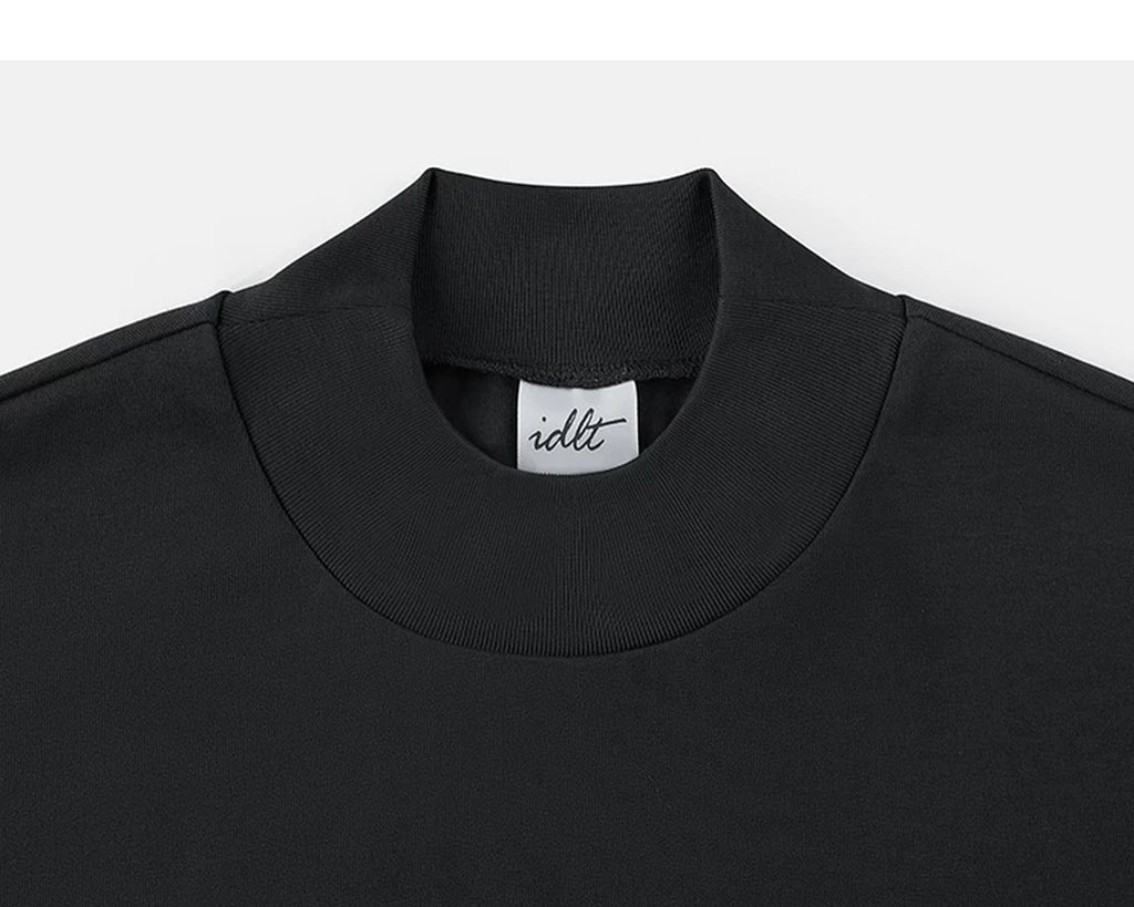 IDLT mock neck T-shirt, black collar.