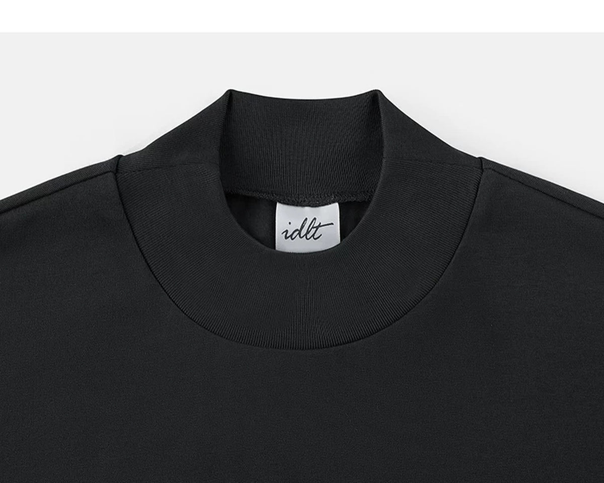 IDLT mock neck T-shirt, black collar.