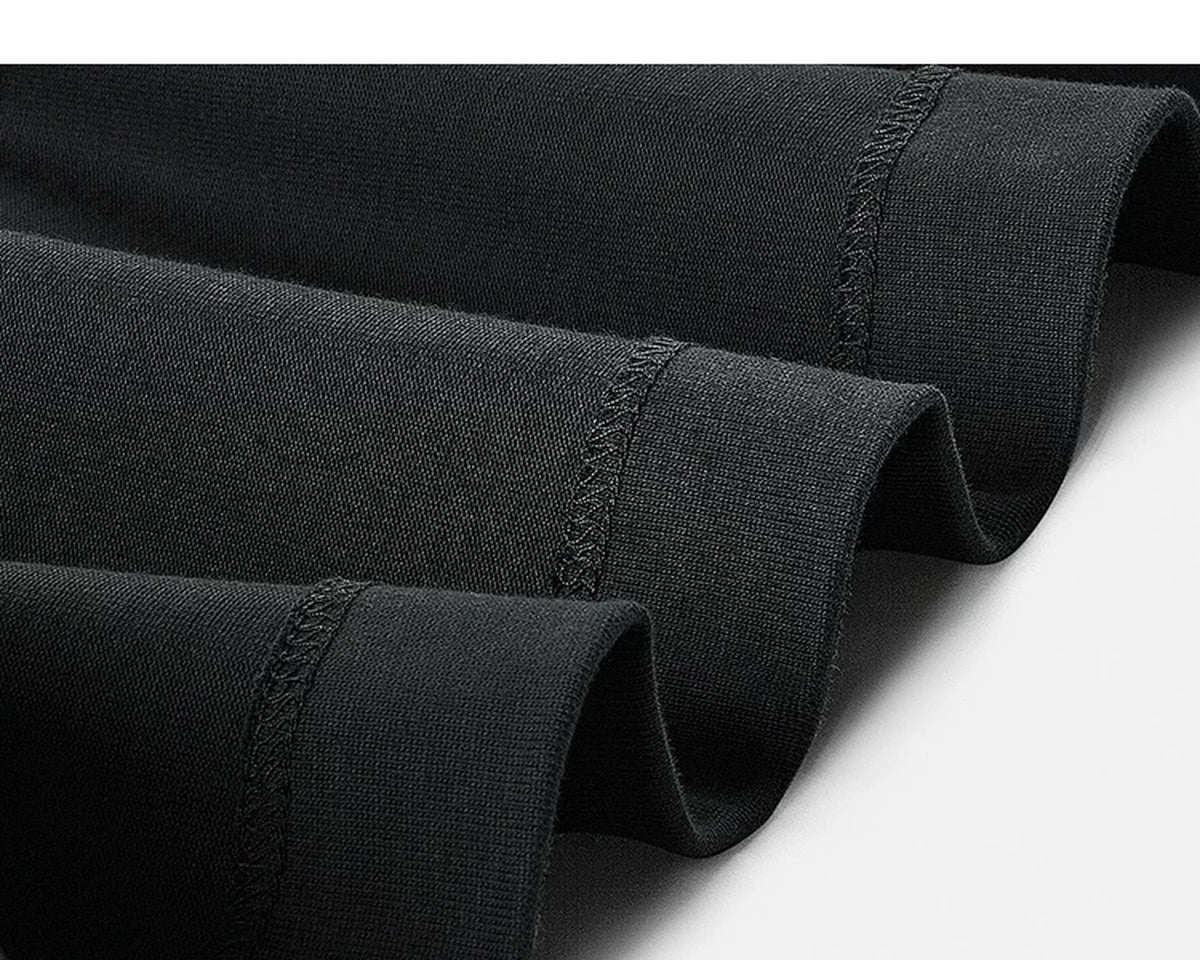 IDLT mock neck long sleeve top, black hem stitching and fabric.