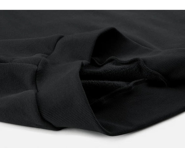 IDLT sweatshirt, black folded ribbed hem.