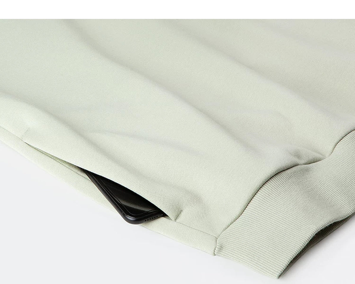 IDLT hoodie, sage green side pocket.
