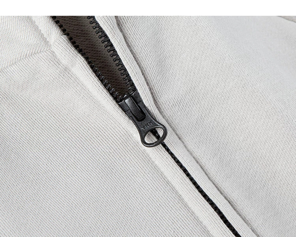 IDLT zip sweatshirt, cream zipper pull.