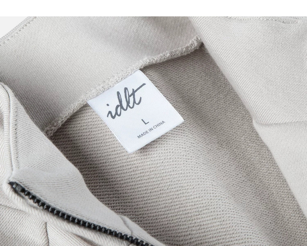 IDLT zip sweatshirt, cream neckline label.