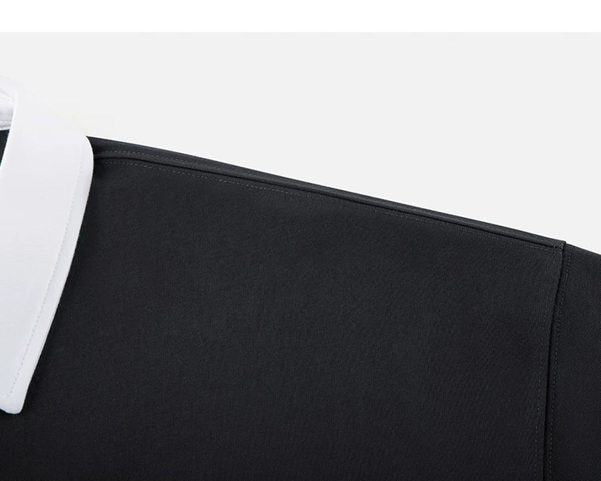 IDLT contrast collar polo, black shoulder seam.