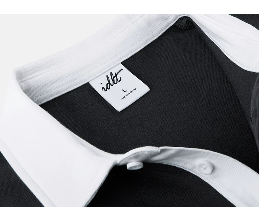 IDLT contrast collar polo, black inner neckline label.