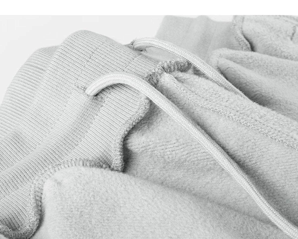IDLT sweatpants, light gray inner waistband stitching.