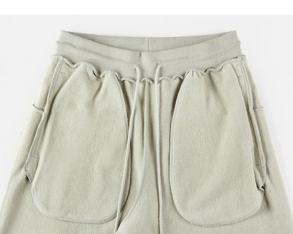 IDLT sweatpants, sage green inner pockets.
